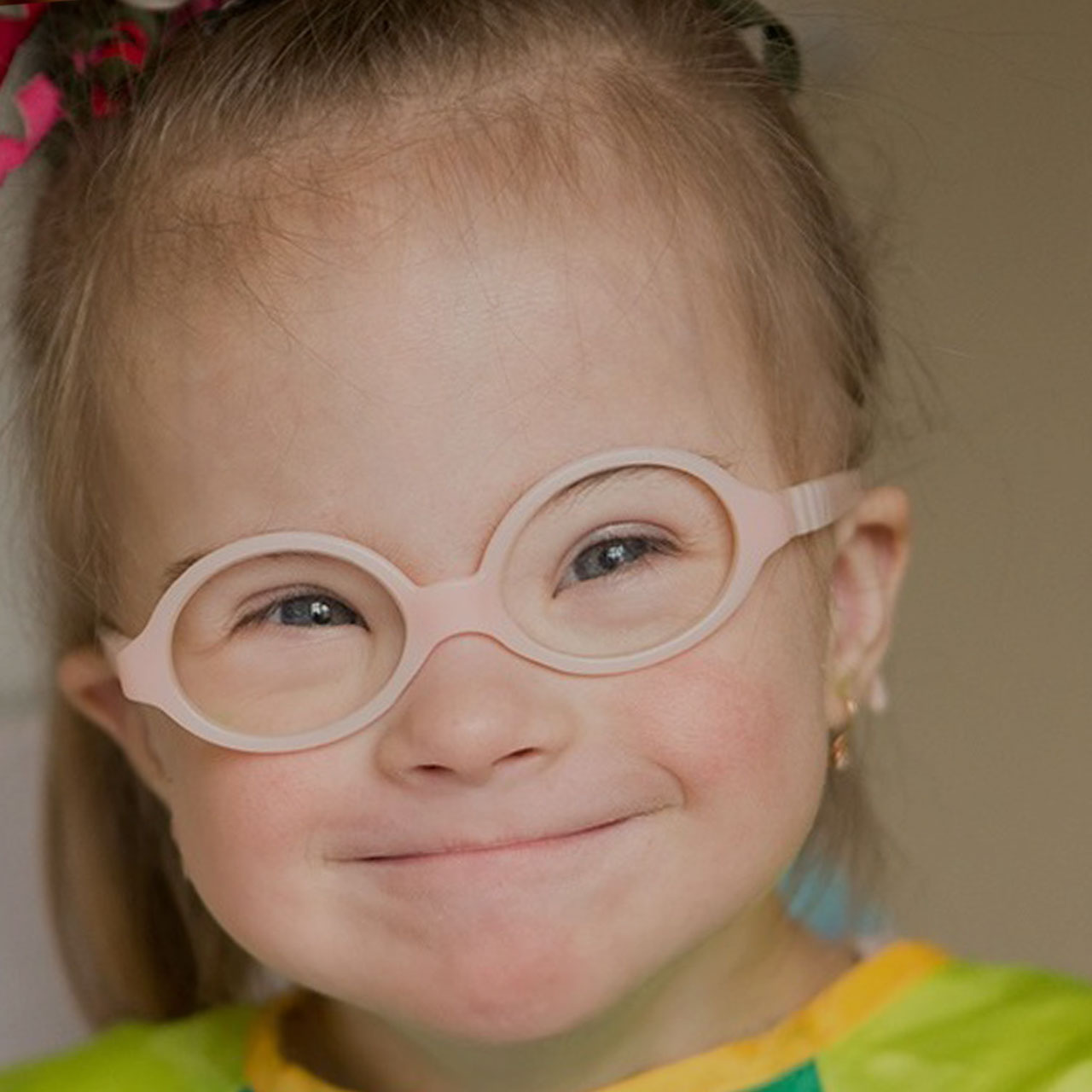 Smiling child wearing glasses